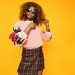 women‘s pink sweatshirt and brown plaid skirt