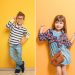 Cute stylish boy near color wall