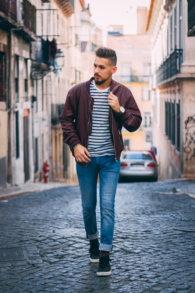 Faded jeans with leather jacket