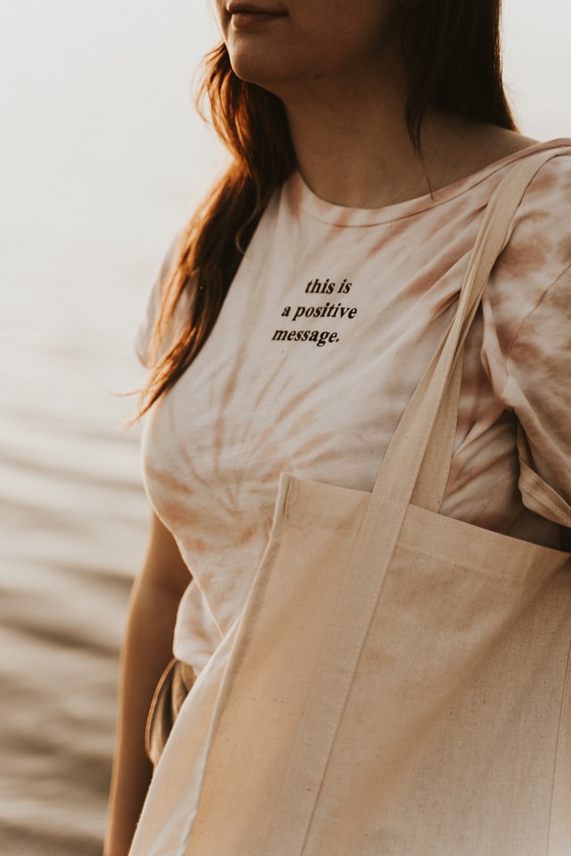 a girl with canvas bag